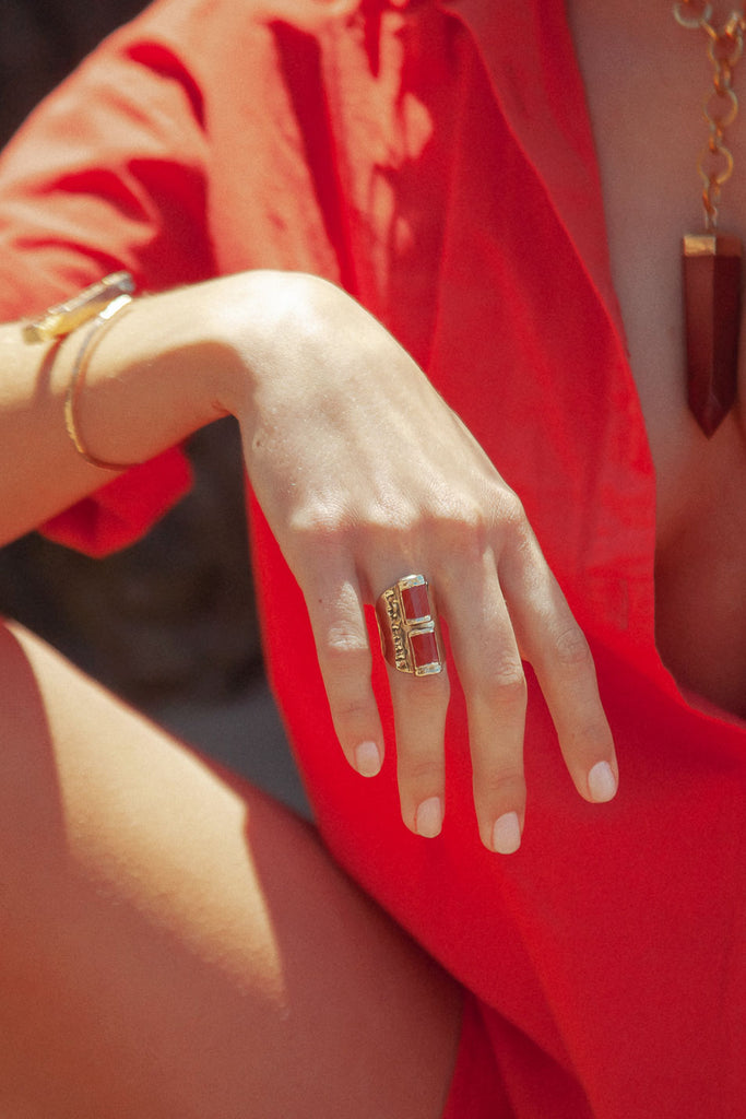 Make a Bold Statement with Ellie: Distinctive Red Jasper Ring. Comfortable and adjustable design, one inch long. Vibrant hue for standout style.