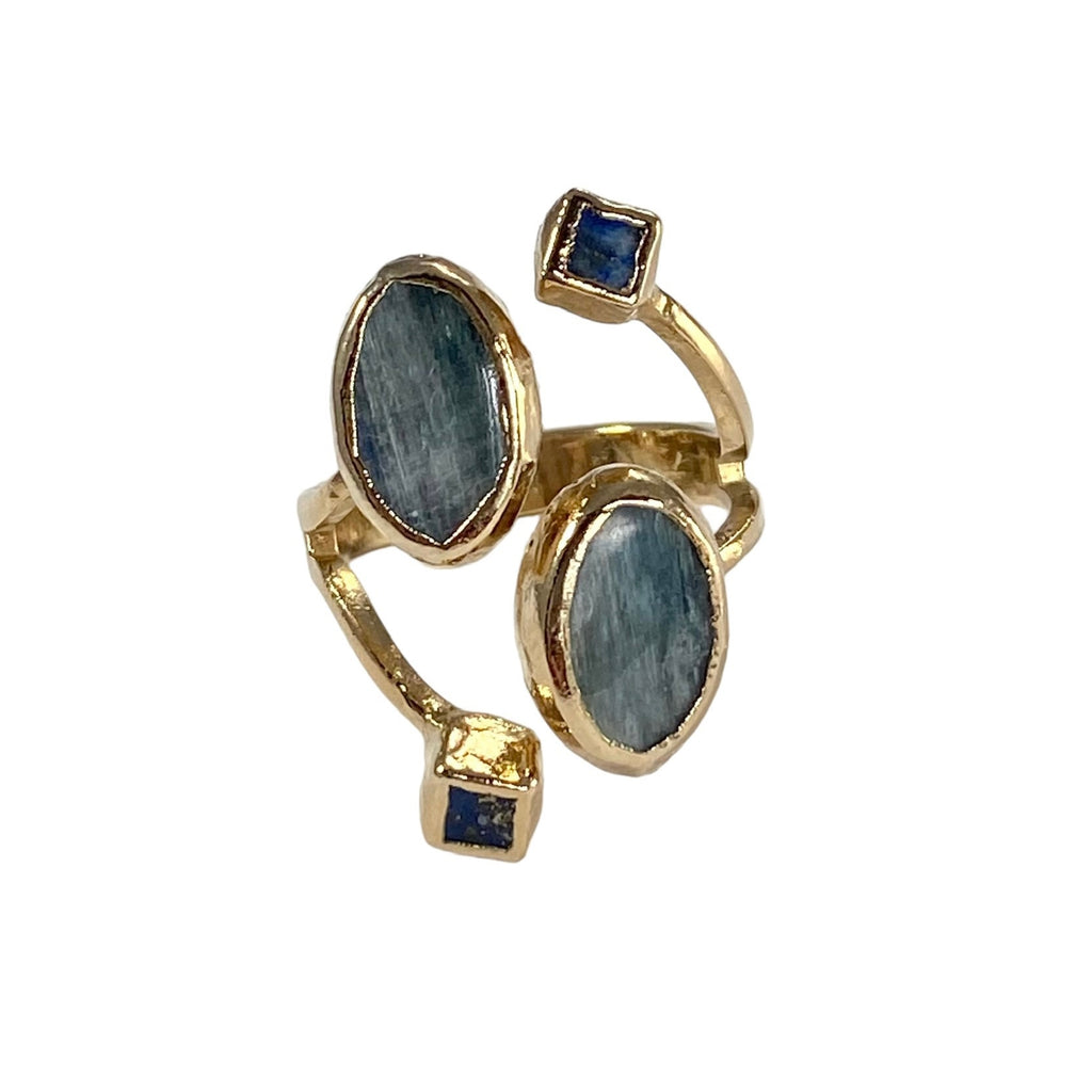 Emma: A stunning masterpiece, this exceptional 4 stone ring showcases exquisite oval Kyanite and square Lapis stones. Meticulously crafted with expert precision, the Lapis stones measure 1/8 inch, while the captivating Kyanite stone measures 1/2 inch in length. Prepare to be captivated by this timeless statement piece.