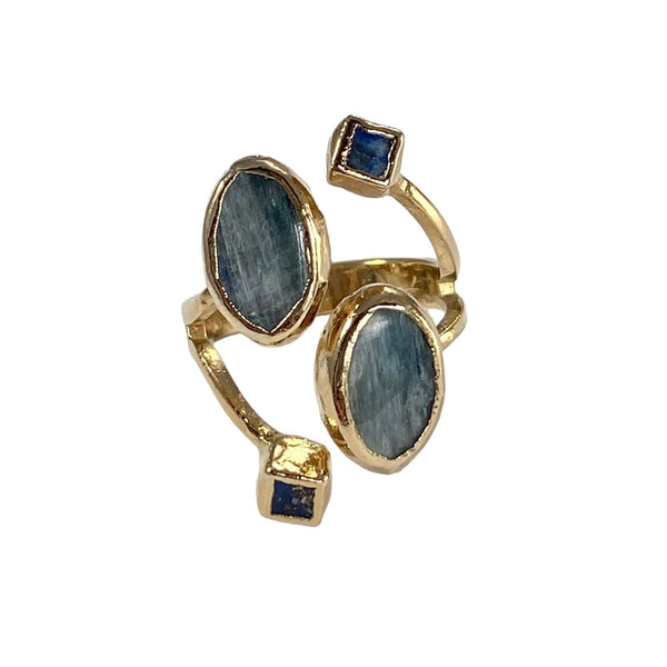 Emma: A stunning masterpiece, this exceptional 4 stone ring showcases exquisite oval Kyanite and square Lapis stones. Meticulously crafted with expert precision, the Lapis stones measure 1/8 inch, while the captivating Kyanite stone measures 1/2 inch in length. Prepare to be captivated by this timeless statement piece.