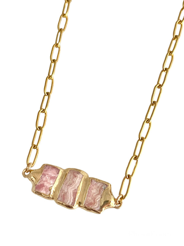 Delilah: Perfect for layering, featuring a small paperclip chain and triple Rhodochrosite stones. Unique and stylish, allowing you to express your individuality and creativity. Stone pendant is 1 inch long, varying in size, shape, and coloration.
