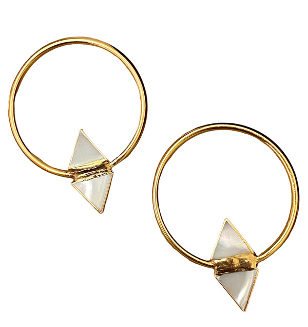 Jenn Tran in the bachelorette. Big hoop earrings with mother of Pearl gold earrings. 