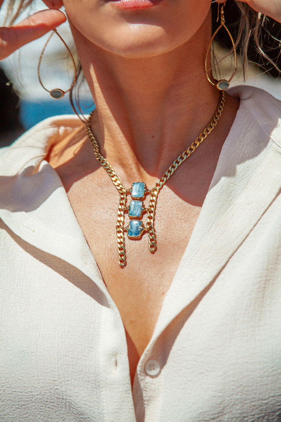 Triple blue kyanite stones on an asymmetrical chain. Stand out with this one-of-a-kind style!