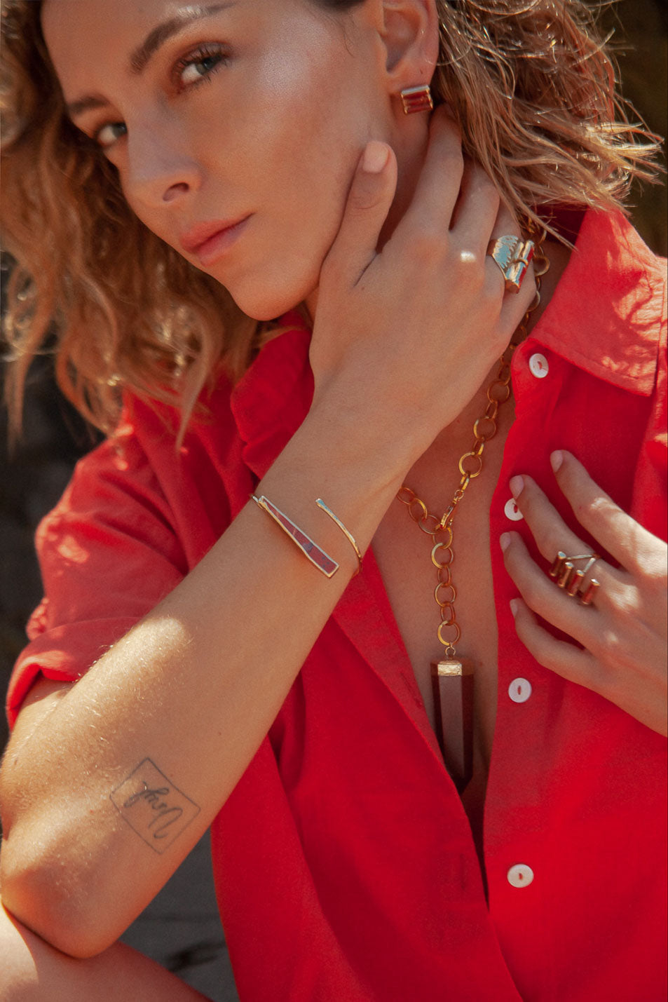 Unique Carter Bracelet: Hand-hammered thin cuff with one-of-a-kind red jasper stick stone. Stone size and color may vary. 1.5 inches long. Add a fun pop to your wardrobe.