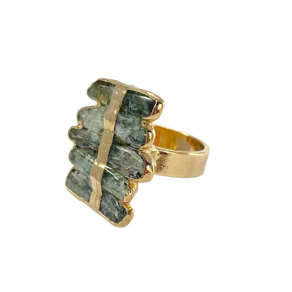 Elevate your style with the unique Layla ring. Featuring elegant kyanite stacked stones, a hand-painted gold stripe, and one-of-a-kind size and color variations. Add glamour and sophistication to any look with this stunning piece.