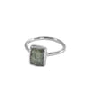 The Zoey Ring: Hand-hammered wire band with square-cut kyanite stones in varying shades of green. Versatile and elegant, ideal for daily wear, effortlessly enhances any outfit.