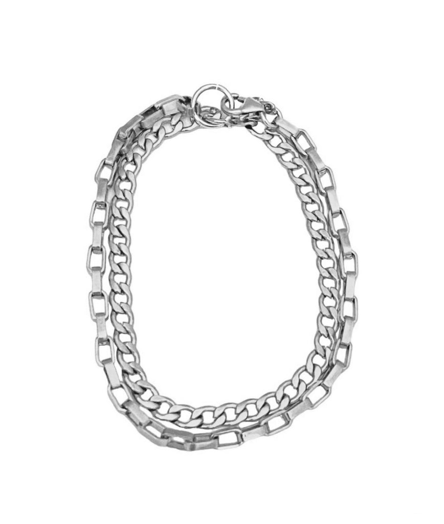 Jordan: Effortless bracelet for layering with 1/8 inch box and flat curb chains. Made of durable stainless steel, adding a subtle and stylish touch to any look. Suitable for all activities, including showers and workouts.