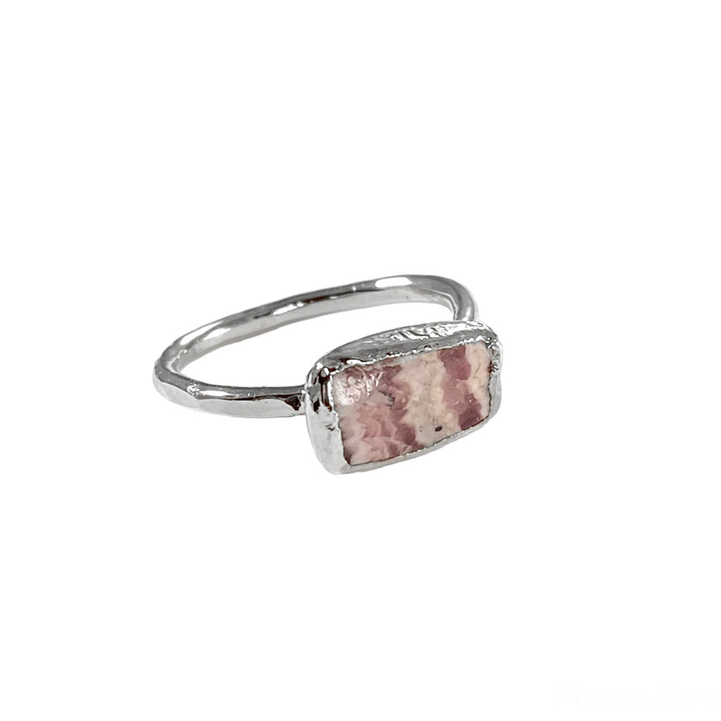 Gianna: Hand hammered thin band ring with unique rectangular Rhodochrosite stone. Versatile and beautiful, each ring is unique with a 1/2 inch stone varying in size, shape, and coloration.