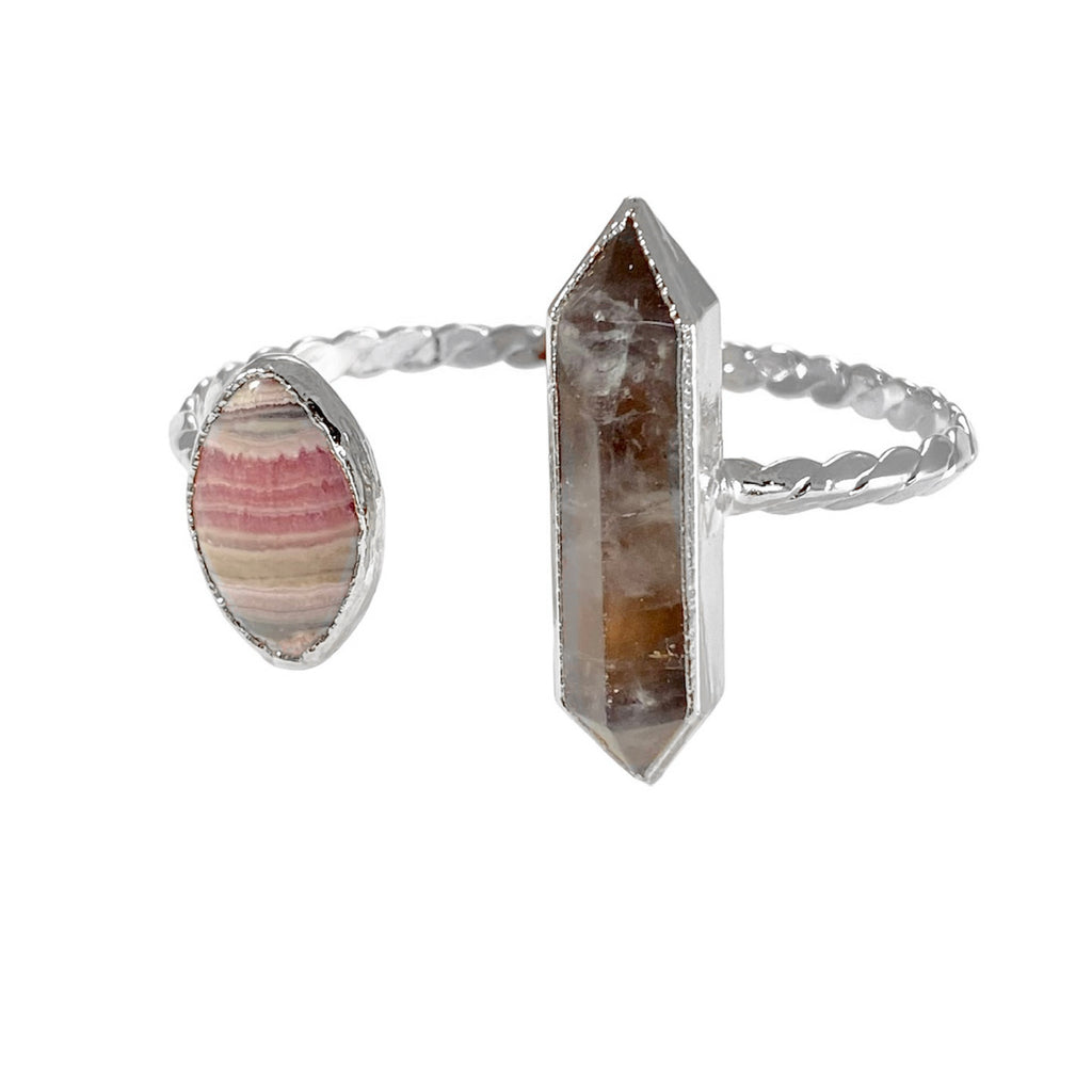 Thomas bracelet: Classic accessory with Rhodochrosite marquis & double-point grey quartz. Stones vary in size & hue. Enjoy timeless design & luxury craftsmanship.