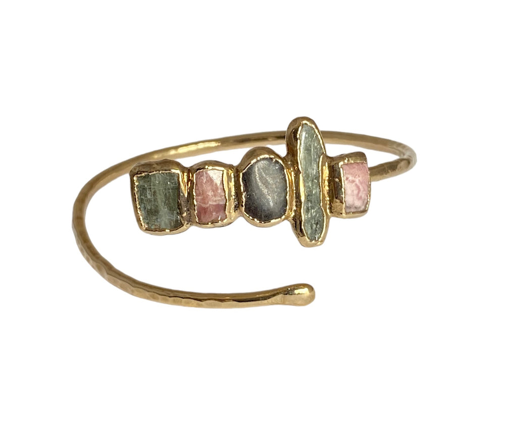 Enhance any occasion with this Lincoln bracelet. Its adjustable design and hand-hammered detailing make it unique, while the Rhodochrocite, Labradorite, and kyanite stones add a captivating touch. Enjoy a touch of luxury with a stunning 1.25-inch cluster of stones!