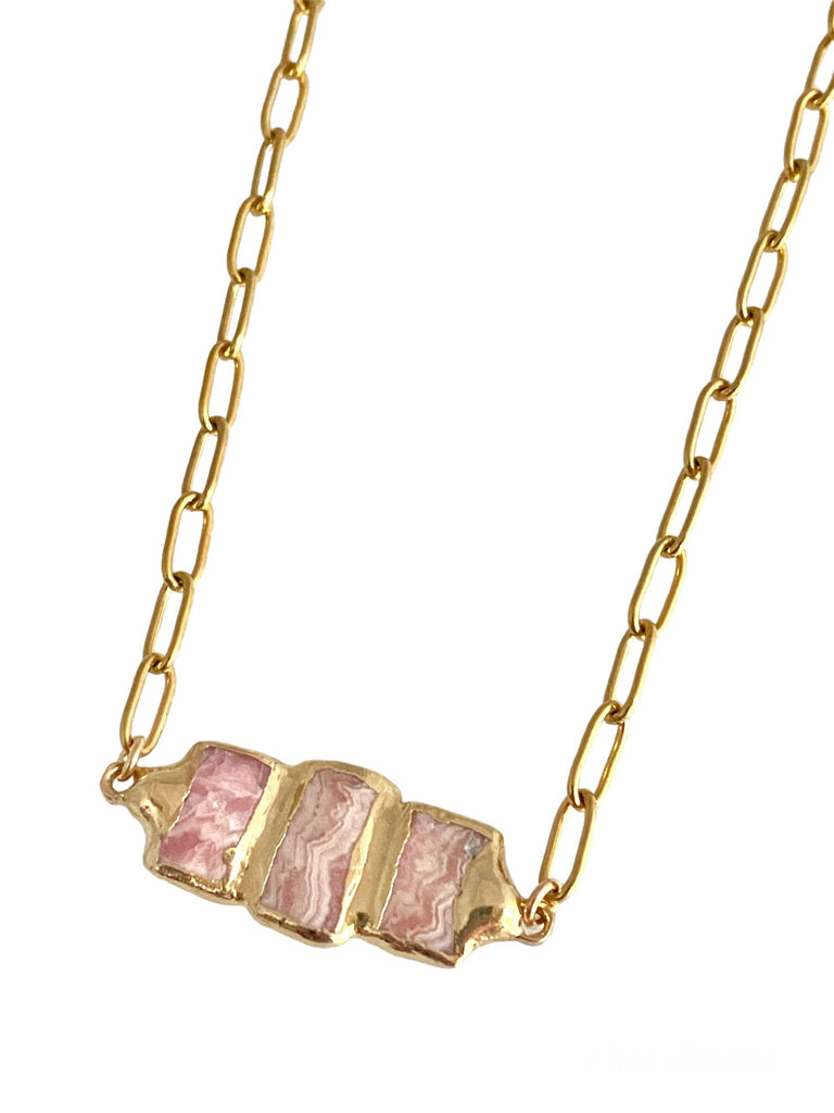 Delilah: Perfect for layering, featuring a small paperclip chain and triple Rhodochrosite stones. Unique and stylish, allowing you to express your individuality and creativity. Stone pendant is 1 inch long, varying in size, shape, and coloration.