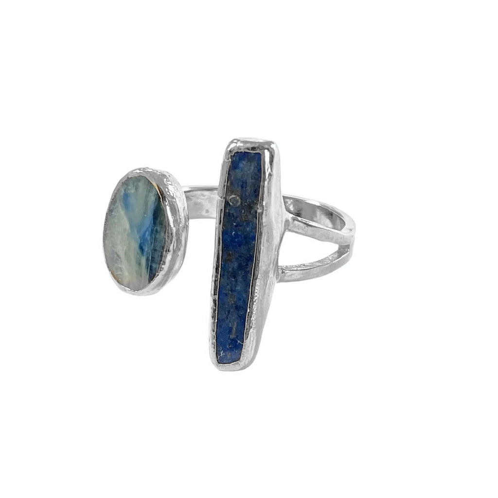The Eleanor ring: a bold statement piece. Unique lapis stick and kyanite stone create a striking combination with varying coloration. Kyanite measures 1/2" while the larger lapis stone is approximately 1" long.